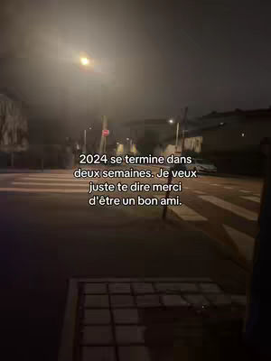 An outdoor night scene with streetlights illuminating a road and crosswalk, with text overlayed.