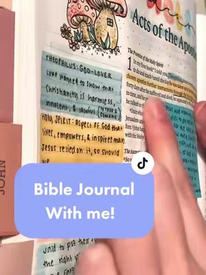 The image shows an open Bible with colorful notes and illustrations. A soft blue rectangle with white text overlays the bottom, stating "Bible Journal With me!". The pages show handwritten annotations, pastel-colored highlighters, and a detailed illustration of mushrooms at the top. The image is in a vertical format with a warm, inviting aesthetic.