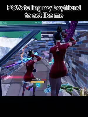 The cover image shows a scene from a video game, Fortnite, with two characters in the foreground. They are positioned in a brightly lit area, possibly a building interior, demonstrating a zone war or other competitive game type. Text overlays the top of the image, describing the situation in first-person, and the action is focused on a pair of female avatars. The setting includes architectural components rendered in the game's style, with a color palette emphasizing blues, whites, and reds.