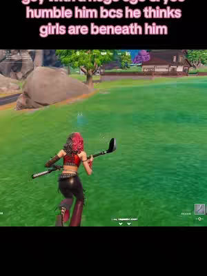 The cover image is a screenshot from the game Fortnite. The central focus is a female character, viewed from behind, holding a golf club. She is standing in a grassy area. In the background there are green hills, trees, and a house.