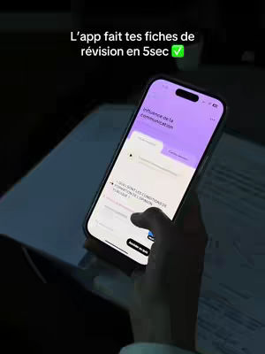 The image shows a hand holding a smartphone displaying an app interface. The user is touching the screen. Text overlayed on the top and a checkmark symbol.