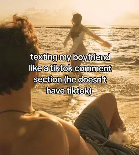 The image shows a man looking towards the water. In the water, a woman walks towards the shore as the sun sets in the distance. Text overlay is present.