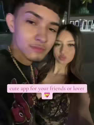 A close-up shot features a young couple, the man on the left and the woman on the right, embracing. The man, with dark hair and a gold chain, is slightly closer to the camera. The woman, with long dark hair, has her lips slightly pursed. Overlaid on them is a pink banner with the text "cute app for your friends or lover" and a heart logo with a yellow heart and a purple heart.