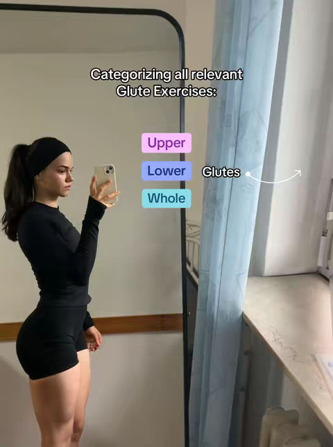 A woman in workout attire stands next to a mirror, holding a phone as she takes a selfie. Text overlays categorize glute exercises into upper, lower, and 'whole' categories. The background includes a window with a light blue curtain.