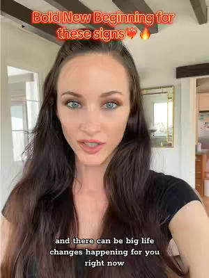 A woman with long brown hair and blue eyes is in the foreground. She is looking directly at the camera with a slight smile. Above her head is red text that says, "Bold New Beginning for these signs."