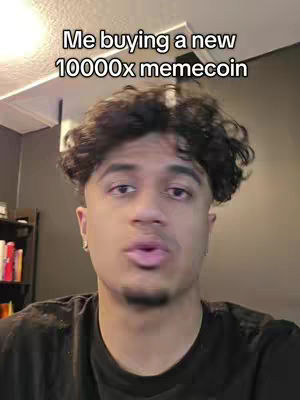 A selfie-style video cover image featuring a young man with dark, curly hair, facing the camera. The man has a moderate complexion, a well-groomed short beard, and is wearing a black t-shirt. The background is dim, with a corner of a room visible, including lighting, and a dark wall color.