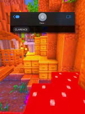 The cover image shows a Minecraft scene with a text message overlay. The background is a vibrant, blocky landscape with orange and green hues. Several yellow storage structures are the focal point, with a large red mushroom-like form in the foreground.  At the top is a text message bubble with the name "Clara" and the text "Clarence".