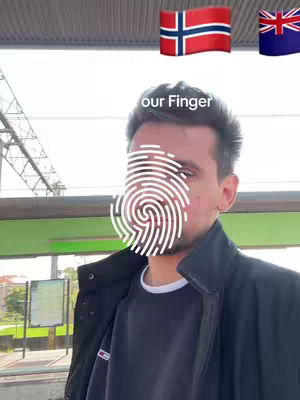 A selfie shot featuring a man against a blurred train station background. Above his head are two flags: the Norwegian flag and the flag of Bermuda. A fingerprint graphic is superimposed over his face.
