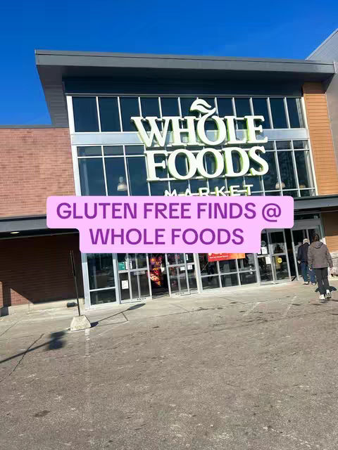 The image shows a Whole Foods Market exterior with signs and an entrance. A pink rectangle overlay with white text stretches across the image, under blue sky