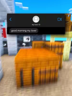 The cover image features a stylized Minecraft environment. In the foreground, there are several stacked, rectangular orange blocks. Overlaid on the scene is a black chat bubble, displaying a text conversation with a profile picture and the greeting message 'good morning my love!'.