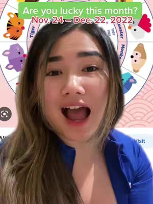 A woman with long brown hair and an open mouth, the background has a pink zodiac wheel, and green text overhead.
