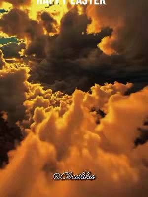 The image shows a sky filled with warm, golden-orange clouds, suggesting a sunrise or sunset. The clouds have a textured appearance, with darker, shadowy areas contrasting against the glowing, highlighted regions. At the top, the text 'HAPPY EASTER' is written in white, and at the bottom, the username '@Christlikes' is written in a stylish script.