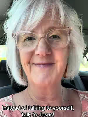 A close-up shot features an older woman with short, white hair and glasses. She is smiling slightly, with text overlaid at the bottom reading, "Instead of talking to yourself, talk to Jesus!"