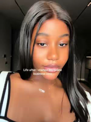 A close-up shot of a young woman looking at the camera with text overlayed. She has long, dark hair and is wearing a white top with a black strap. The background is blurred, suggesting an indoor setting. The text overlaid on the image is 'Life after I started my online business' followed by three right-pointing arrows.