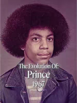 An image of Prince, mid-shot, facing slightly to the right. He has a soft expression, with a large afro and a denim jacket. The text overlay reads "The Evolution Of: Prince 1967".