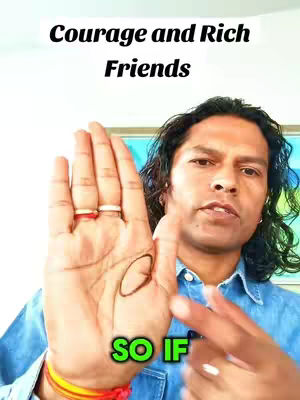 A man's hand is held up, palm facing the camera. Text overlays the image, and the man has long hair with rings and a wristband