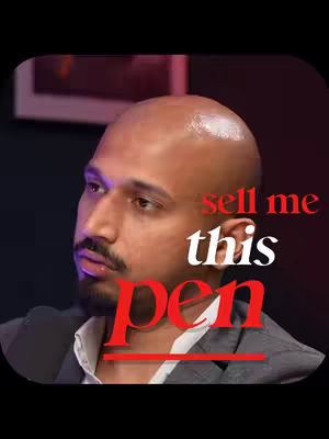 A close-up shot of a bald man with a mustache, wearing a blazer. Text overlays read "sell me" and "this pen", with the word "pen" in a contrasting color.