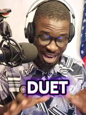 A man with glasses and headphones smiles with his mouth open, a microphone and the word DUET are visible, and an American flag is in the background.