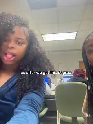 The cover image shows two young Black women in a brightly lit room, likely an office or classroom setting. The woman on the left has her tongue out. The text overlay, "us after we get this degree," is present near the bottom of the image.