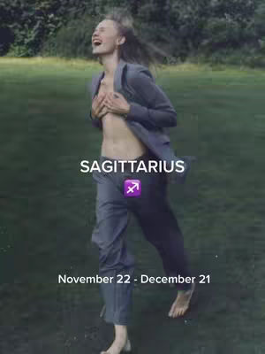 A woman in a gray suit, with her blazer open, is shown in a natural setting with her hands on her chest looking up with a gleeful expression. Text overlays include the zodiac sign 'SAGITTARIUS', its symbol, and the dates November 22 - December 21.