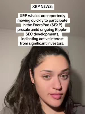 A woman with long dark hair and a light gray top, with text overlay on top of her that contains crypto news about XRP. She is looking at the camera with a neutral expression and pink lipstick.