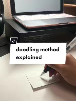 The cover image shows a person's hand holding a pen, with white text over a photo that includes a laptop and a piece of paper. A pen is held over a small, white paper. The background has a laptop on top of a dark box-like structure. The cover includes a text overlay.