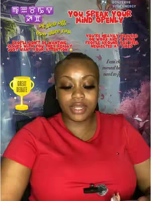 A woman with a shaved head in a red t-shirt looks directly at the camera. Behind her is a blurred background with purple and pink colors and text overlays. There's a small yellow graphic of a trophy.