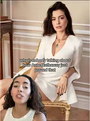 The cover image features a split screen with two women. On the bottom is the creator, a woman with a light complexion, wearing a white tank top. On the top is a professional shot of actress Anne Hathaway, sitting in a chair wearing a white dress. White text overlays the picture of Hathaway.