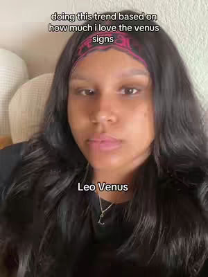 A woman with long black hair is centered in the cover image. She is wearing a black top and a pink headband. The text overlay says: 'doing this trend based on how much i love the venus signs' and 'Leo Venus'.