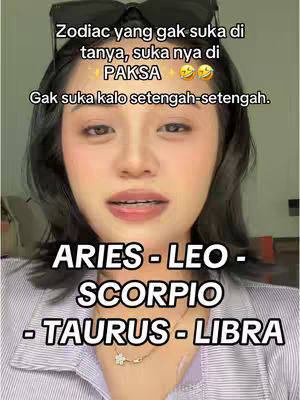 A woman with black sunglasses on her head and her face in frame, wearing a striped button down shirt and necklace. Text overlays detail the video's astrology theme. Below the woman are listed the Aries, Leo, Scorpio, Taurus, and Libra zodiac signs.