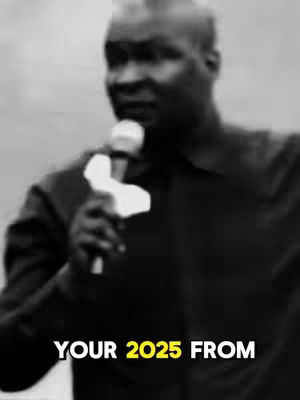 A grayscale image of a man holding a microphone, with text overlayed at the bottom. The man, who appears to be African, is dressed in a dark suit and is focused on the microphone. The background is blurred, but seems to be outside. The text says 'YOUR 2025 FROM' in white and yellow fonts.