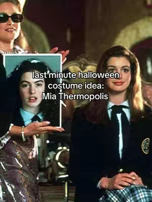 The cover image shows a scene from a movie, potentially "The Princess Diaries." There are two main figures: on the left, a person is holding a photo of someone, and on the right is another person. The text overlay reads "last'minute halloween costume idea: Mia Thermopolis."
