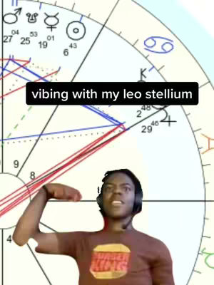 The image shows a person wearing a headset and a t-shirt with a Burger King logo. The background has a horoscope chart overlaid, showing various astrological symbols and lines. Text overlay reads "vibing with my leo stellium"