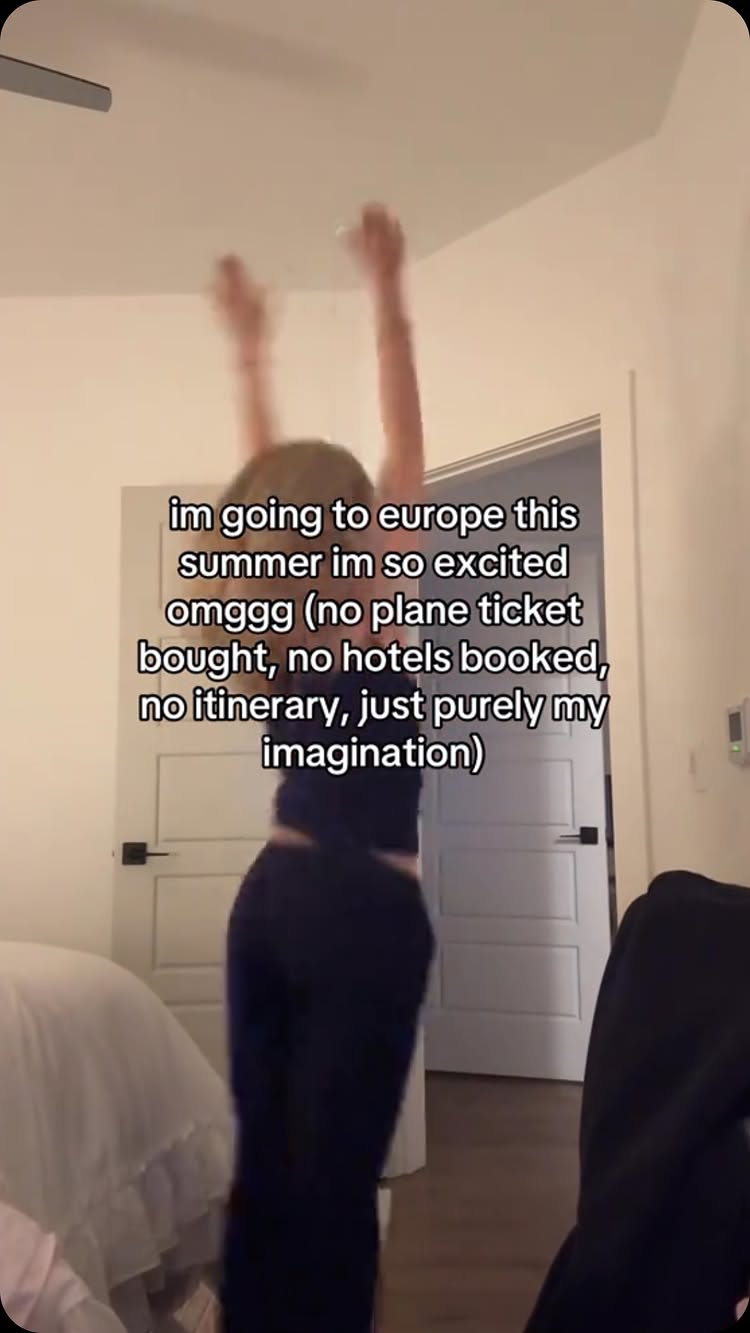 A person is dancing in an interior setting, arms raised. The background includes a bedroom, light-colored walls, and a closed door. Text overlayed on the image indicates excitement about a future trip to Europe, but the imagination is the key factor.