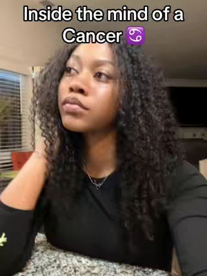 A young woman gazes off-screen thoughtfully, posed in front of a soft-focus background. The cover image is dominated by her curly, dark hair, with text overlayed above her head.