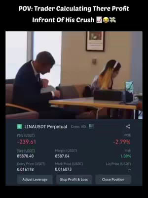 The image shows a scene from what appears to be a trading platform, with two individuals in a room, one focused on a laptop displaying trading data, while the other person is somewhat turned away in the background. The foreground features a display of financial data, highlighting a loss in the account.