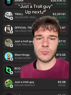 A man in a maroon shirt is framed from the chest up. To the right of the man is a screenshot of a crypto-currency app, showing ticker information with currency values and a few logo icons with names such as "TROLL," "OFFICIAL TRI," and "IRISHGUY," seemingly related to meme coins, with a text hook overlayed at the top.