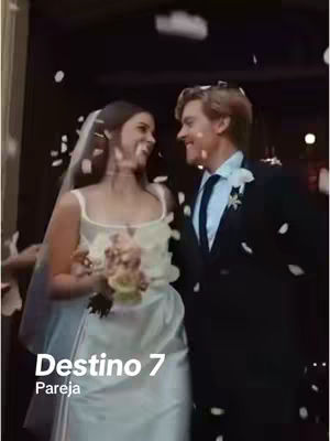 A wedding scene featuring a man and woman smiling at each other. They are standing under a doorway as confetti falls around them. The woman is wearing a white wedding dress and veil, and the man is in a dark suit and tie. The photo is slightly blurred, suggesting a candid shot, with a text overlay at the bottom.