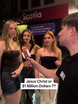 A man holding a microphone interviews three young women on the street, posing a question from a text overlay.