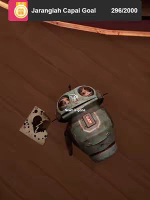 The image features a robot-like figure with large eyes, set against a wooden, brown background. To the left is a torn drawing of a broken heart, while the figure appears tilted on a brown wooden surface. The overall composition has a somber tone.