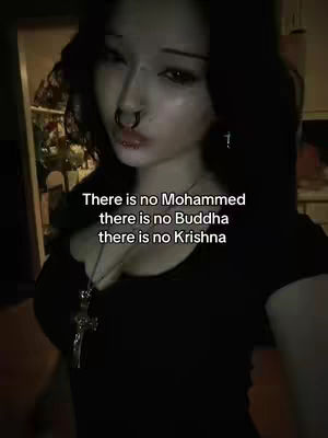 A woman with dark hair and a nose ring is centered in the frame. Text overlays the image.