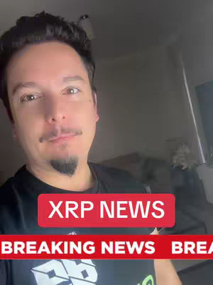 A man with dark hair and a goatee is centered in the frame, with a red banner reading "XRP NEWS" across the top. Below, a second red banner displays "BREAKING NEWS". The background is dimly lit, suggesting an indoor setting.