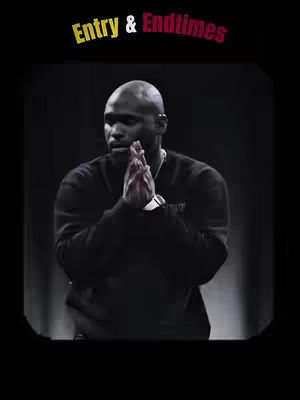 A man with a shaved head is in the center of the shot, his hands clasped together in front of his chest. The background is a dark, undefined space. Text at the top reads 'Entry & Endtimes' in a stylized font.