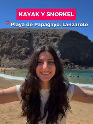 A woman with long dark hair smiles at the camera. Behind her is a beach scene with a mountain and clear blue sky. Text at the top says Kayak y Snorkel.