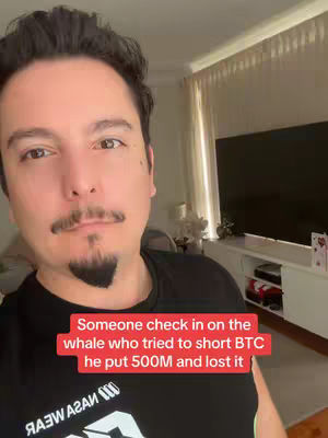 The cover image features a man in a black shirt, centered in a selfie-style shot. He has dark hair and a goatee, and is positioned in front of a domestic interior with a window and a television visible in the background. The text is a red rectangle in the lower third. The man appears to be addressing the camera directly.