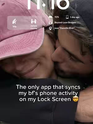 Two individuals are embracing, the image appearing to be a screenshot of a phone's lock screen. The phone shows a pink baseball cap, and contact named James, overlayed with a time display. The hook at the bottom promotes an app that syncs a partner's phone activity on Lock Screen