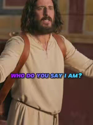 The image features a man with long, dark, wavy hair, and a thick beard. He is wearing a light-colored tunic and a brown leather shoulder strap is visible across his chest. The man has an open expression, perhaps speaking and light is shining on his face. Overlaying the image is a text overlay in vivid blue and purple, creating a contrast that emphasizes the focus.