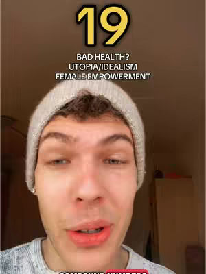 A close-up shot of a young man's face, centered in the frame. He is wearing a light gray beanie and a gray shirt. Above his head, a large '19' is displayed in a golden-yellow color. Below the number, text reads: 'BAD HEALTH? UTOPIA/IDEALISM FEMALE EMPOWERMENT'. The background is a blurred mix of warm tones.
