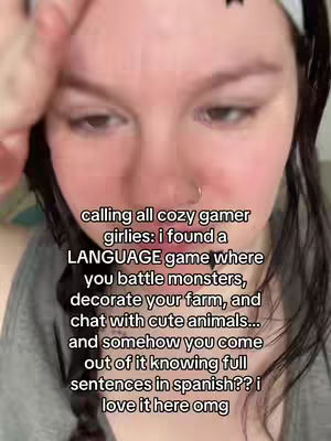 A close-up shot of a person's face, with text overlayed. The person has dark hair, a nose ring, and is looking down. The background is blurred.