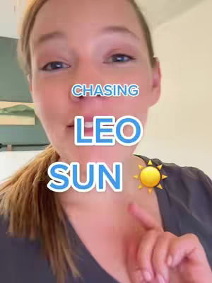 A selfie-style video cover with a woman looking directly at the camera. Text overlays read "CHASING," "LEO," and "SUN" in a blue, bubble-style font, with a yellow sun icon next to "SUN." The background is slightly blurred.